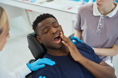 Sick man at the dentist in the hospital