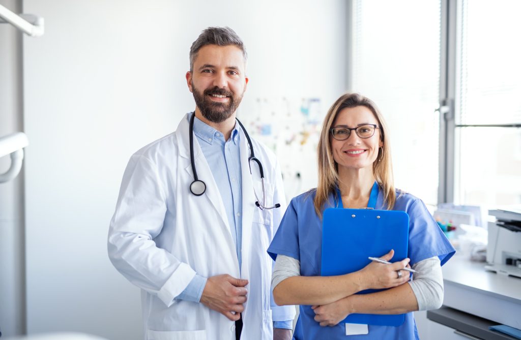 A dentist with dental assistant
