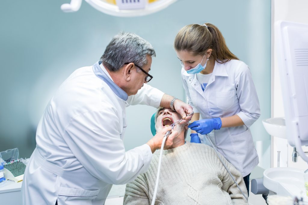 Dentist and assistant at work.