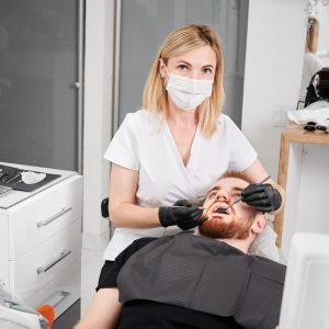 Female dentist examining